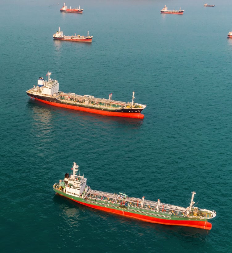 fleet-of-gas-carriers-at-sea-two-col
