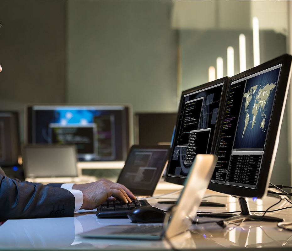 man-at-computer-and-office